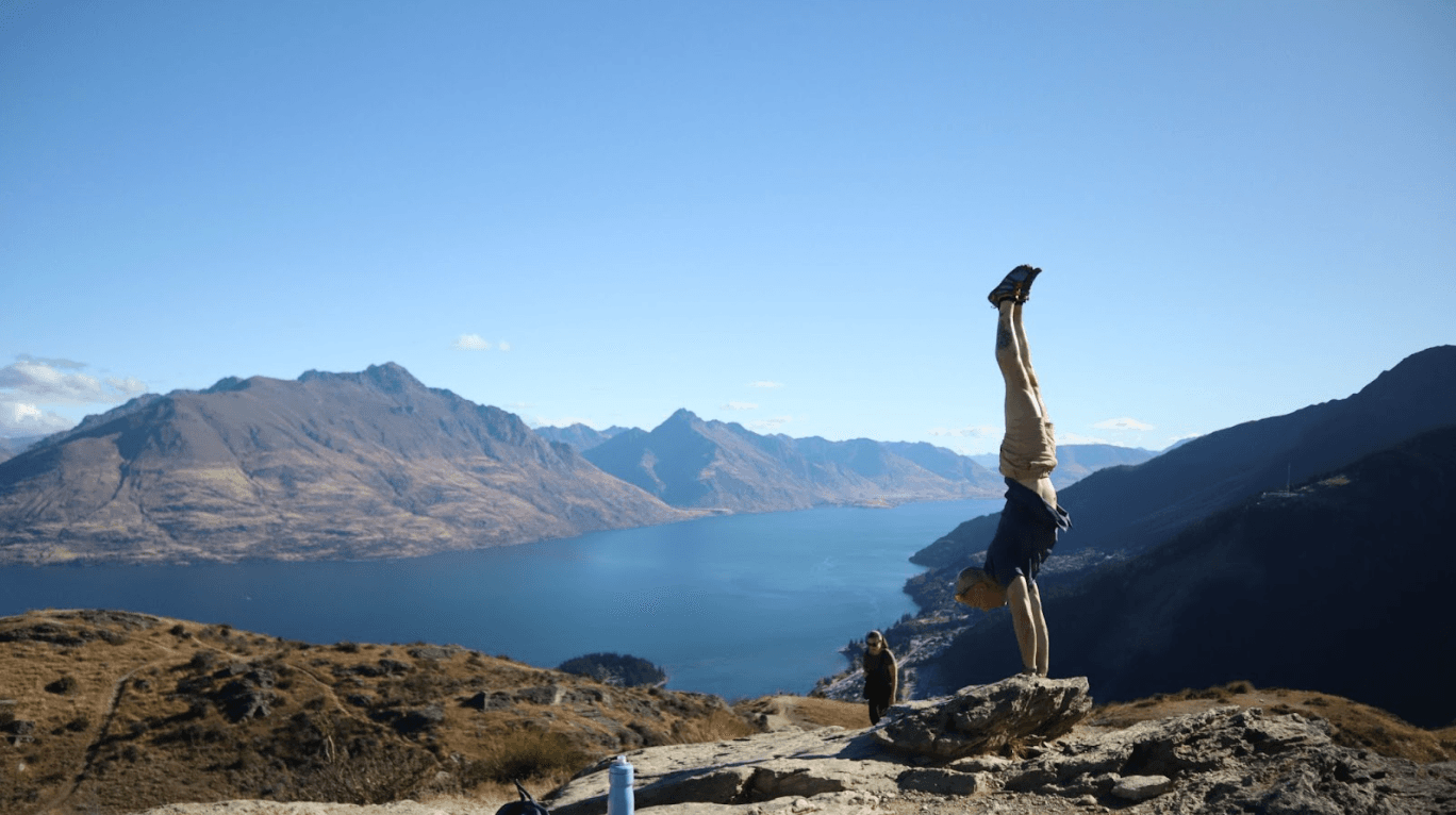 Coach Travis hitting a handstand hold while traveling