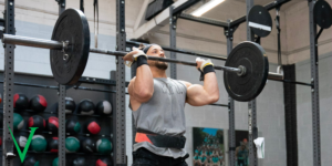 Athlete doing a thruster in the CrossFit Open 22.3 workout.