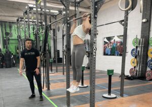 Athlete doing pull-ups in the CrossFit Open 23.2 workout.