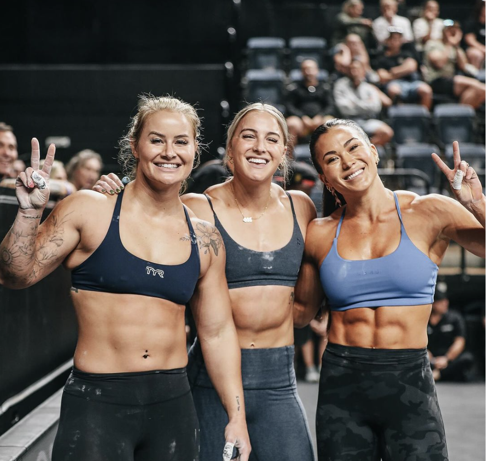 Dani Speegle, Jessie Smith and Emily Rethwill celebrate their first place finish at Down Under Championships.