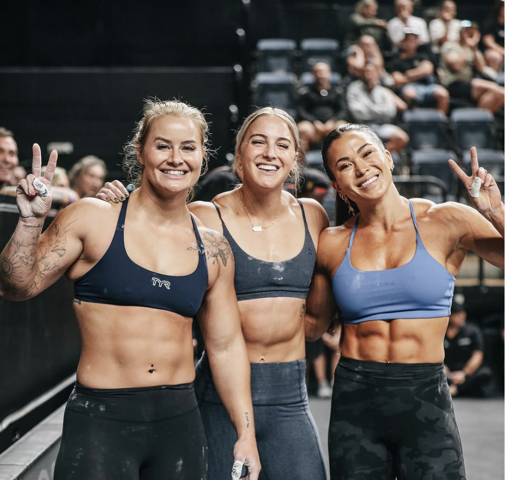 Dani Speegle, Jessie Smith and Emily Rethwill celebrate a 1st place finish at the Down Under Championship.