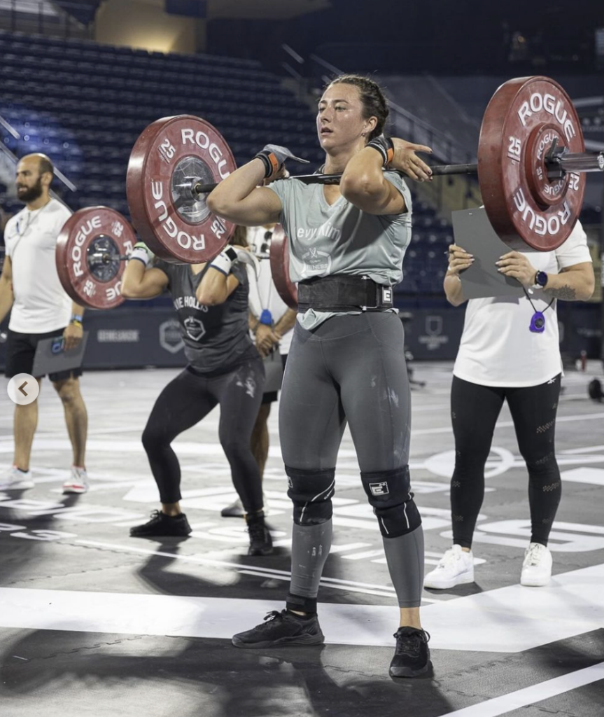 Devyn Kim power cleans a heavy barbell at the Dubai Fitness Championship.