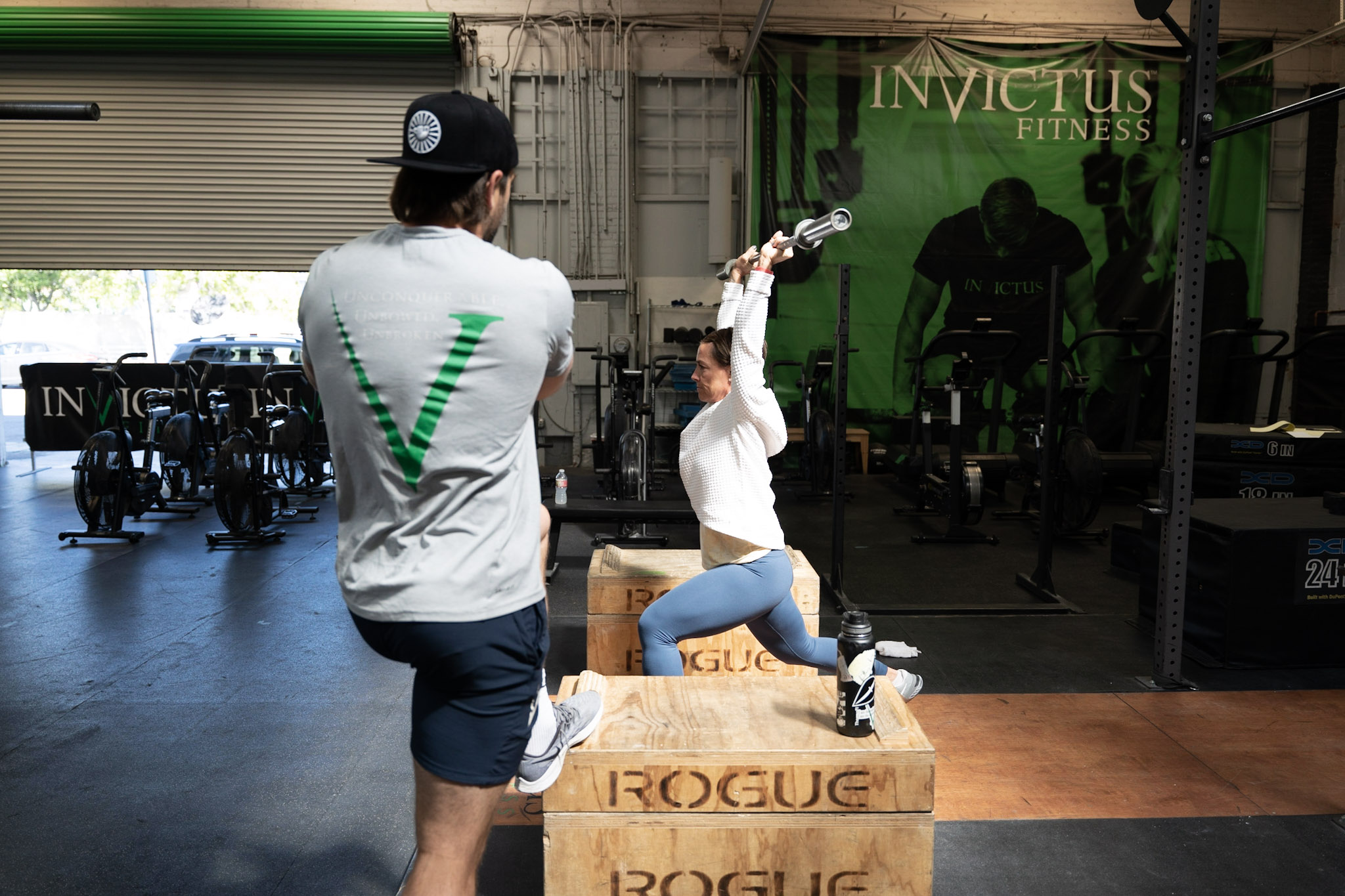 Coach Holden watching an Invictus Athlete snatch in a 1 on 1 coaching session