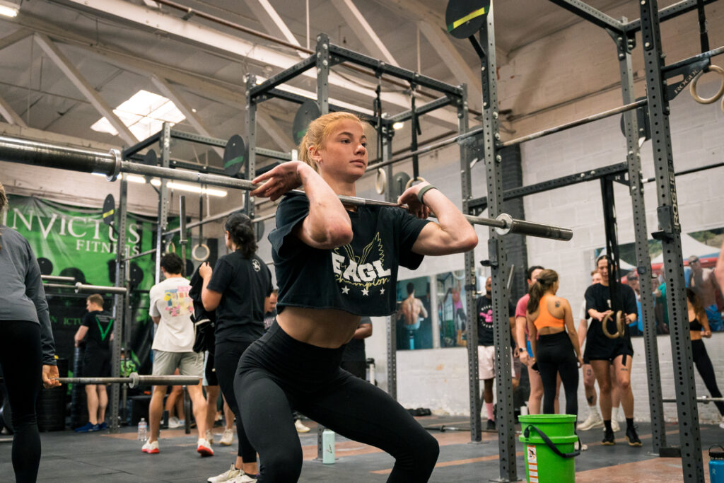 An athlete working on technique with a barbell. 